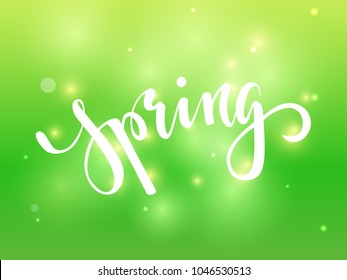 Spring. Hand drawn calligraphy and brush pen lettering on green blured background with bokeh. design for holiday greeting card, invitation, posters, sale, banners of the happy sping.