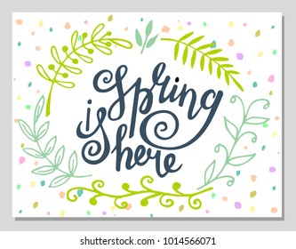'Spring is here' hand lettering with decorative elements isolated on white background. Typographic design card.