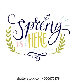 'Spring is here' hand lettering with decorative elements isolated on white background. Funny typographic design card.