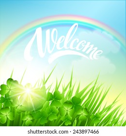 Spring landscape with clover and rainbow