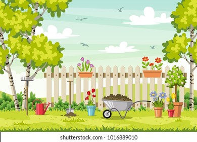 Spring landscape with garden tools