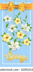 Spring lettering in frame with hanging blossoms, flowers and ribbon on blue background. Calligraphic inscription can be used for greeting cards, postcards, posters, banners.