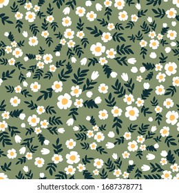 Spring meadow. Trendy fabric pattern with small flowers. Botanical seamless print with different floral elements. Vintage textile collection.