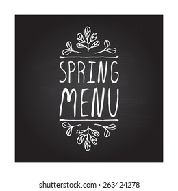 Spring menu hand-sketched typographic element on chalkboard background. Restaurant label. Suitable for ads, signboards, menu and web banner designs
