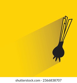 spring onion on yellow background