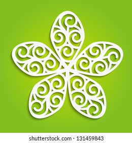 Spring paper flower on green
