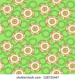 Spring pattern from beige flowers on a green background