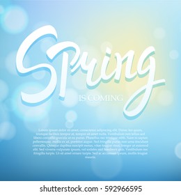 Spring phrase vector lettering. Hand drawn calligraphy blue background.