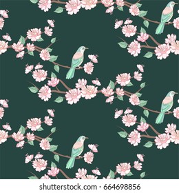 Spring sakura flowers and birds seamless pattern with blossom branch on green background.