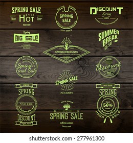 Spring sale badges logos and labels for any usem, on wooden background texture