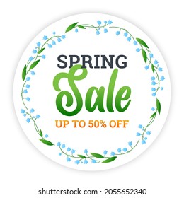 Spring sale banner. Discount text on a circle background with a beautiful wreath of green leaves. Special offer up to 50% off.