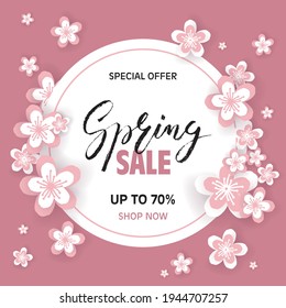 Spring Sale brush lettering on pink background with sakura flowers in paper-cut style. Template for sale card, banner, wallpaper, voucher, poster, flyer. Vector illustration. EPS10