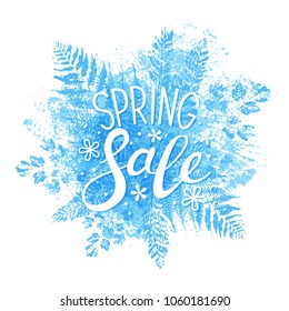 Spring sale message on blue leaves background