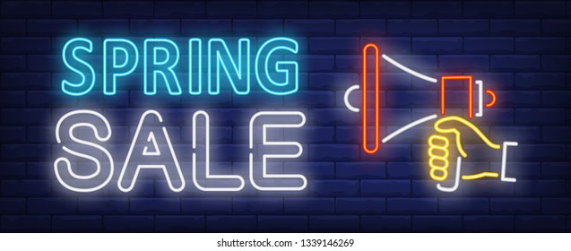 Spring sale neon text with hand holding megaphone. Announcement, discount, advertising design. Night bright neon sign, colorful billboard, light banner. Vector illustration in neon style.