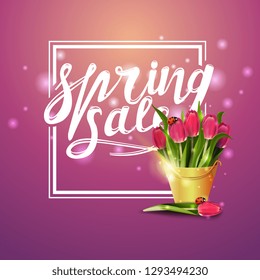 Spring sale. Pink banner with bouquet of tulips in a yellow bucket