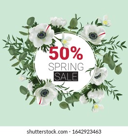 Spring sale poster design with realistic vector flowers (anemones) and green branches.