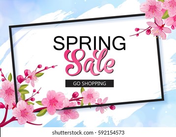 Spring sale vector banner design with flowers and frame. Cherry blossoms and blue sky background.