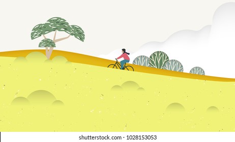 Spring scenery landscape, man riding bicycle on the hill surrounded by yellow flower fields and trees