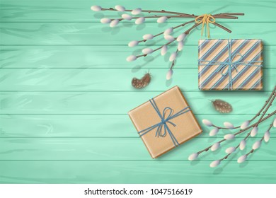 Spring top view wooden background with a gifts, feathers and pussy willow branches