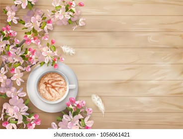 Spring top view wooden background with cappuccino and blossoming tree branches on wooden background