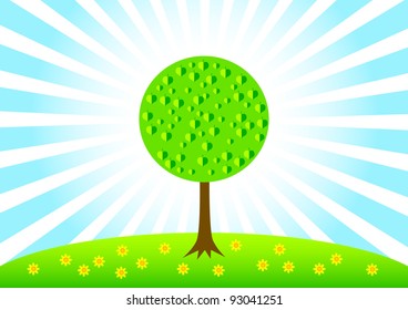 Spring tree on green meadow