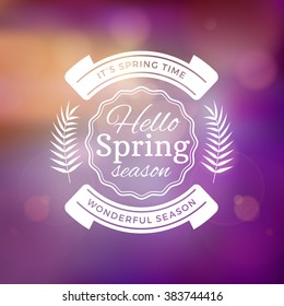 Spring Vintage Typographic Badge on Colorful Blurred Background. Spring Vector Illustration. Hello Spring. Greeting Card Design