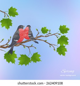 Spring watercolor background  with a branch of maple and birds on a blurred blue background