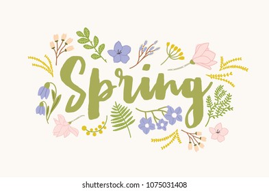 Spring word handwritten with elegant cursive calligraphic font and surrounded by beautiful blooming flowers and leaves. Gorgeous seasonal lettering isolated on white background. Vector illustration