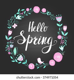 Spring wreath and hand lettering on the blackboard