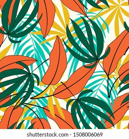 Spring-summer seamless tropical pattern with plants and leaves in shades of green and orange on a delicate background.Beautiful exotic plants. Trendy summer Hawaii print.