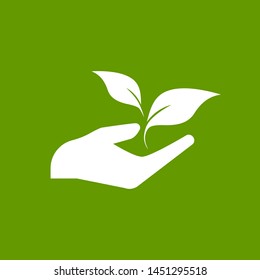 Sprout in a hand. Hand holding sprig with leaves. growth, start up. Idea developing. Vector illustration on green  background. Environment protection. Eco friendly thinking.