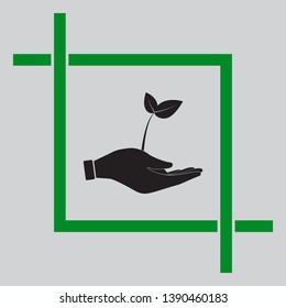 Sprout in a hand sign of environmental protection. Black icon inside green crop tool at light gray background