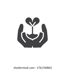 Sprout in a hand vector icon. filled flat sign for mobile concept and web design. Hands holding plant glyph icon. Environment protection symbol, logo illustration. Vector graphics