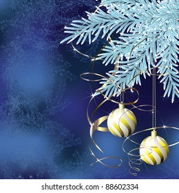 Spruce branches with golden christmas balls on a blue background
