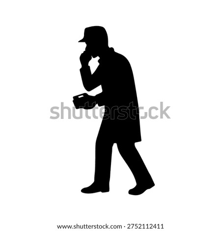 Spy man silhouette talking on the mobile phone
