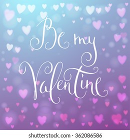 Square abstract blur blue background with heart-shaped lights over it and hand written Valentine's day greetings.