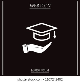 A square academic hat with a palm brush