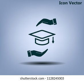 A square academic hat with a palm brush