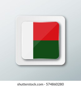 Square button with the national flag of Madagascar with the reflection of light. Icon with the main symbol of the country.