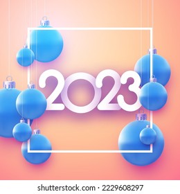 Square frame with 2023 sign and realistic hanging blue christmas baubles.