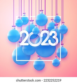 Square frame with 2023 sign and realistic hanging blue christmas baubles.