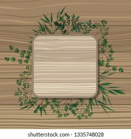 square frame with laurel leafs wooden background