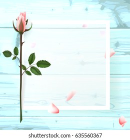 A square frame, a place for text with flowers of a pink rose, a petal on a wooden background. Can be used as a wedding invitation, birthday greeting card, engagement, thank you card. 