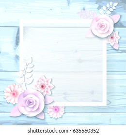 A square frame, a place for text with paper flowers, a petal on a wooden background. Can be used as a wedding invitation, birthday greeting card, engagement, thank you card.