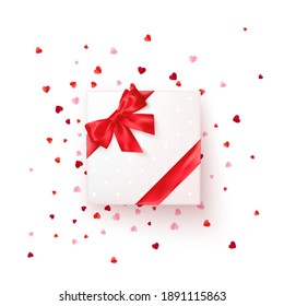 Square gift box with red silk ribbon and bow. Present for Valentine's day decorated confetti. Vector