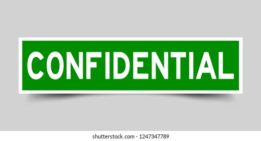 Square green color sticker with word confidential on gray background