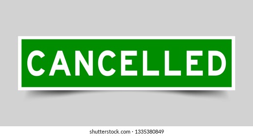 Square green color sticker with word cancelled on gray background