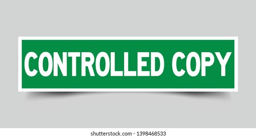 Square green color sticker with word controlled copy on gray background