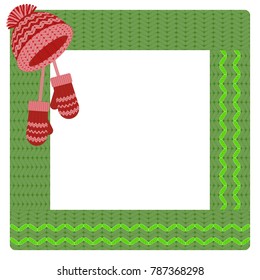 square green crocheted frame, decorated with a red cap and mittens. For decor, photo album.