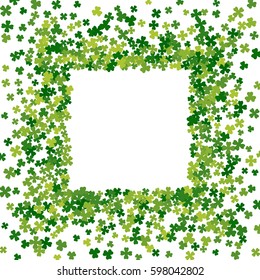 Square green frame, border or background of random scatter clover leaves. Elegant St. Patricks day design for festive banner, greeting card, postcard, flyer. Vector illustration.